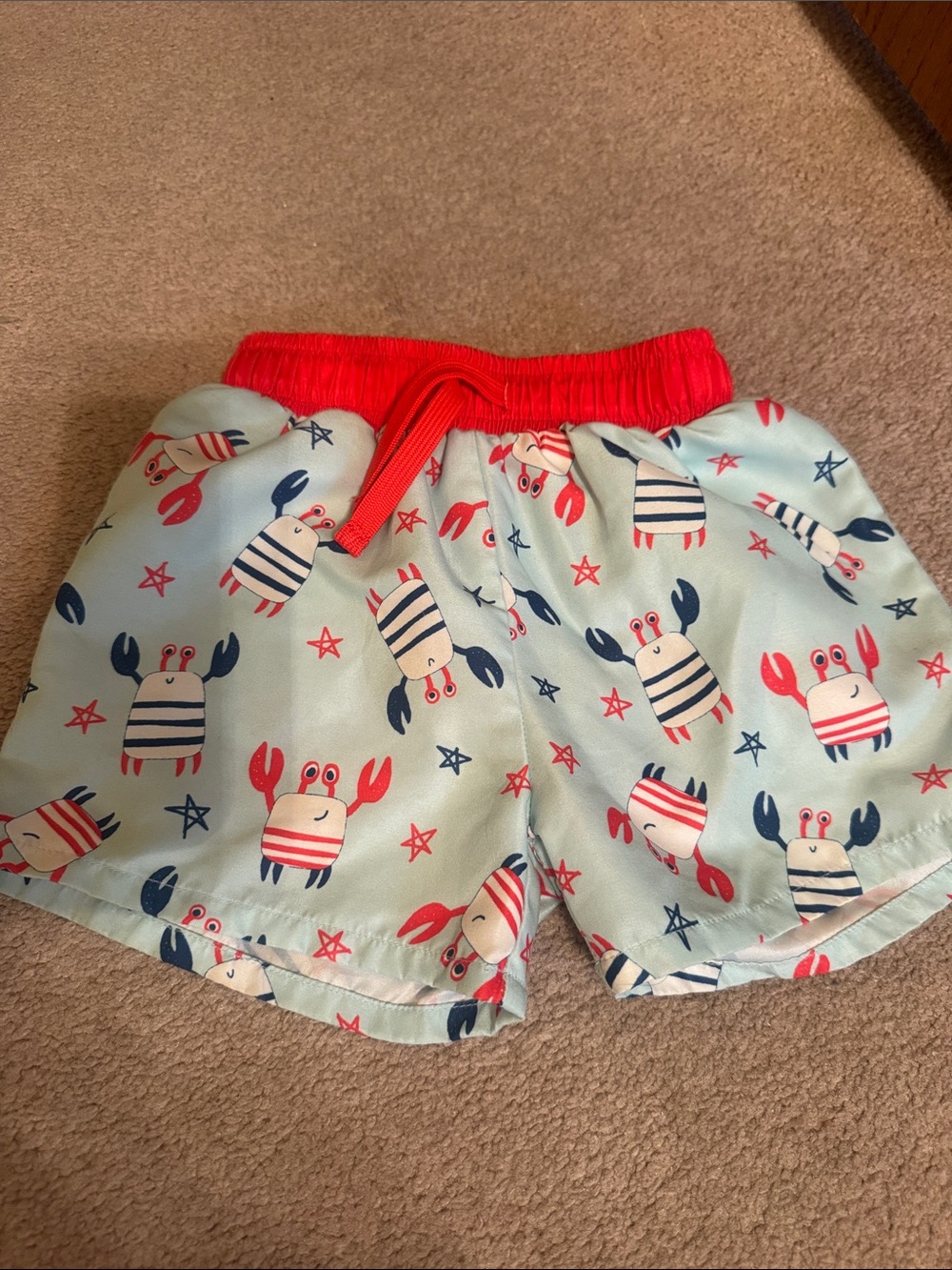 Caden Lane Swim Shorts with Red Waistband and Crab Print. 2T